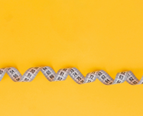 Woman experiencing perimenopause-related weight gain and hormonal changes