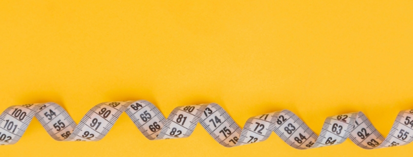 Woman experiencing perimenopause-related weight gain and hormonal changes